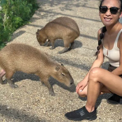 a woman petting a dog